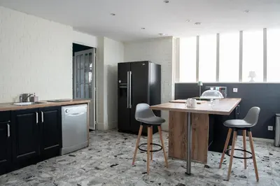 Cuisine ou kitchenette dans l'établissement Le Saint-Quentin - Studio avec Terrasse