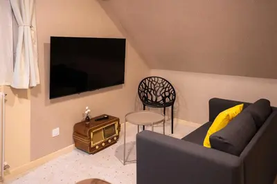 Télévision ou salle de divertissement dans l'établissement Terres de Soleil - Bohème Chic en cœur St Quentin