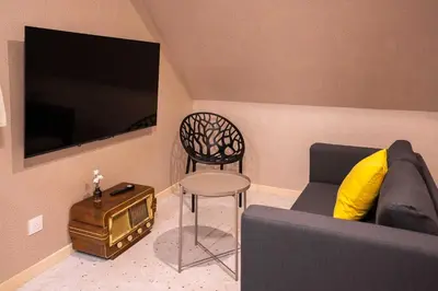 Télévision ou salle de divertissement dans l'établissement Terres de Soleil - Bohème Chic en cœur St Quentin