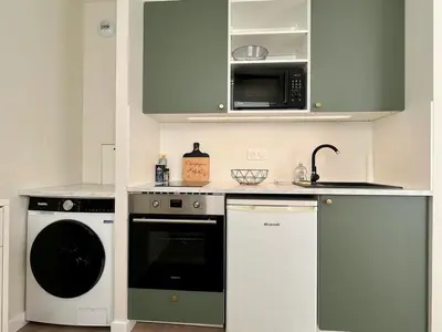 Cuisine ou kitchenette dans l'établissement Appartition au cœur de Reims