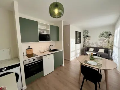 Cuisine ou kitchenette dans l'établissement Appartition au cœur de Reims