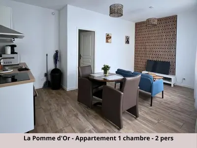 Coin salon dans l'établissement Les Appartements de la Pomme Rouge