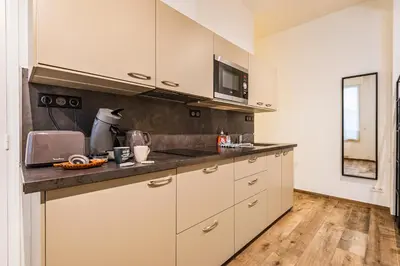 Cuisine ou kitchenette dans l'établissement suite Tirelire, centre et paisible