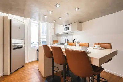 Cuisine ou kitchenette dans l'établissement MM Suites City House Cathedrale