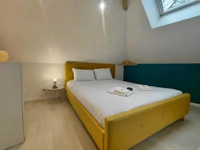 Un ou plusieurs lits dans un hébergement de l'établissement C Coispine T3 confortable en bord de meuse
