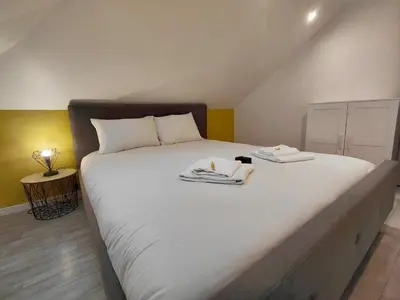 Un ou plusieurs lits dans un hébergement de l'établissement C Coispine T3 confortable en bord de meuse