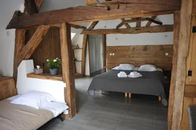 Un ou plusieurs lits dans un hébergement de l'établissement La Bergerie Du Château De Pommeuse
