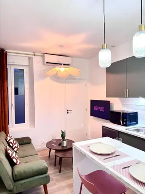 Coin salon dans l'établissement T2 Cosy - Proche centre - Stationnement gratuit