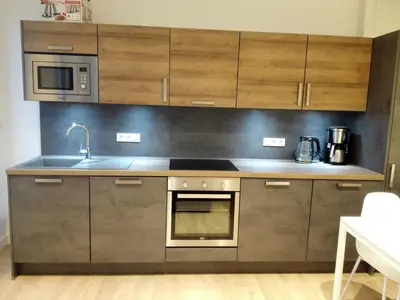 Cuisine ou kitchenette dans l'établissement Apartment T2 Helle Stadtzentrum Voltaire Zimmer Hof by Interhome