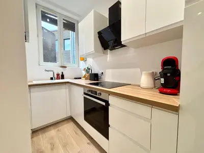 Cuisine ou kitchenette dans l'établissement Elégant appartement au coeur de Reims