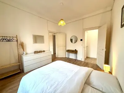 Un ou plusieurs lits dans un hébergement de l'établissement Elégant appartement au coeur de Reims