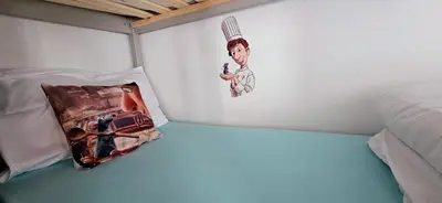 Un ou plusieurs lits dans un hébergement de l'établissement La Chambre de Ratatouille proche Disney