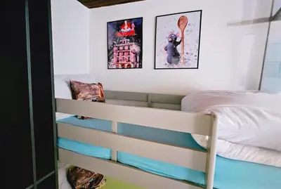 Un ou plusieurs lits dans un hébergement de l'établissement La Chambre de Ratatouille proche Disney