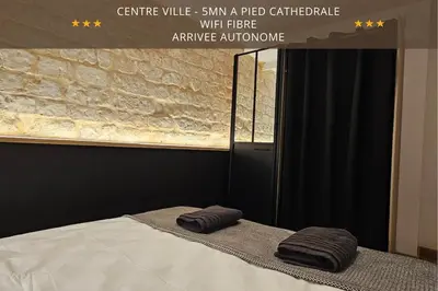 Un ou plusieurs lits dans un hébergement de l'établissement Opus Reims Jard - Centre ville