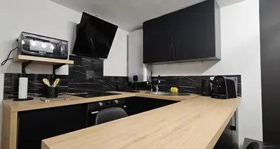 Cuisine ou kitchenette dans l'établissement Opus Reims Jard - Centre ville