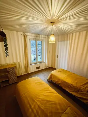 Un ou plusieurs lits dans un hébergement de l'établissement Large and cozy family home
