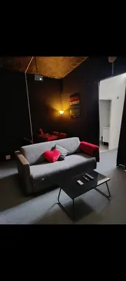 Coin salon dans l'établissement Instant Cinéma-Détente et Romantisme
