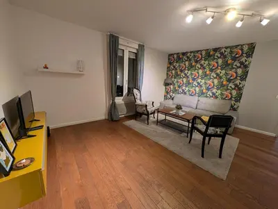 Télévision ou salle de divertissement dans l'établissement Le 49 Leclerc