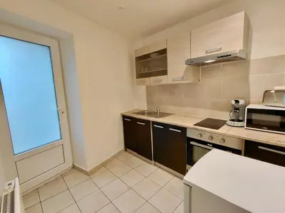 Cuisine ou kitchenette dans l'établissement C Coispine 1 Cosy studio RDC vue sur la Meuse