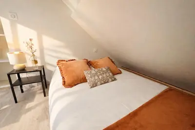 Un ou plusieurs lits dans un hébergement de l'établissement Urban Duplex
