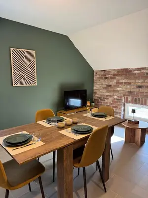 Télévision ou salle de divertissement dans l'établissement Appartement à Ohain