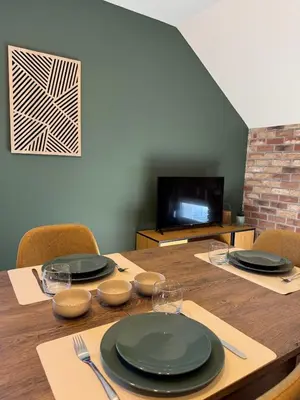 Télévision ou salle de divertissement dans l'établissement Appartement à Ohain