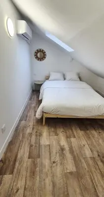 Un ou plusieurs lits dans un hébergement de l'établissement Magnifique Duplex Avec Terrasse, Proche De Av Champagne