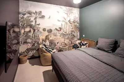 Un ou plusieurs lits dans un hébergement de l'établissement Songe de Savane - Spa Ultra-centre St Quentin