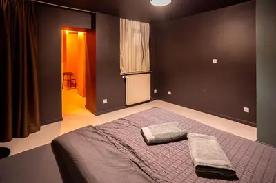 Un ou plusieurs lits dans un hébergement de l'établissement Horizon des Sens - Spa&Sauna Epicentre St Quentin