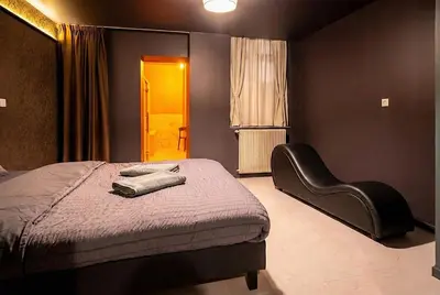 Un ou plusieurs lits dans un hébergement de l'établissement Horizon des Sens - Spa&Sauna Epicentre St Quentin