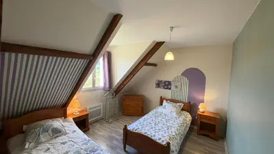Un ou plusieurs lits dans un hébergement de l'établissement Gite du tilleul 6 personnes à la campagne proche Disneyland Paris