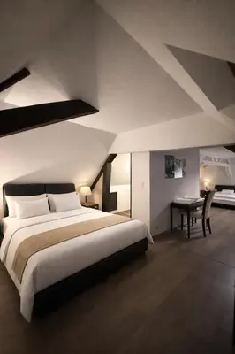 Un ou plusieurs lits dans un hébergement de l'établissement Le Flaubert Hôtel