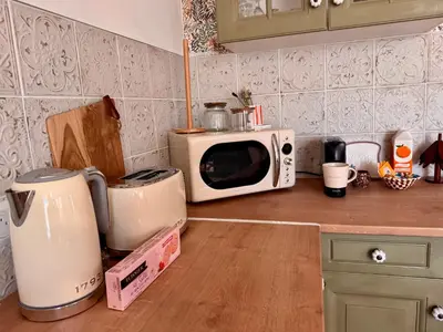 Cuisine ou kitchenette dans l'établissement La Romance