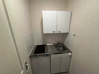 Cuisine ou kitchenette dans l'établissement Appartement centre Compiègne