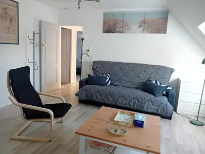 Coin salon dans l'établissement Appartement dans petite ville près de Reims