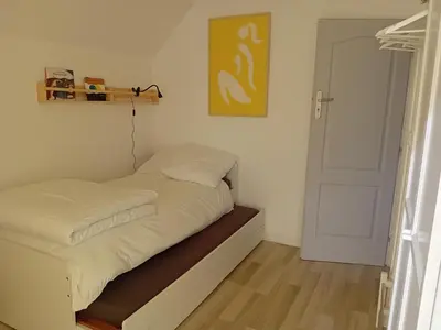 Un ou plusieurs lits dans un hébergement de l'établissement Appartement dans petite ville près de Reims