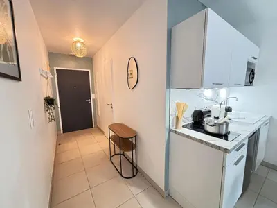 Cuisine ou kitchenette dans l'établissement Le Rainssant studio cocooning en RDC au centre
