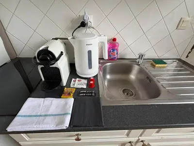 Cuisine ou kitchenette dans l'établissement Studio au château