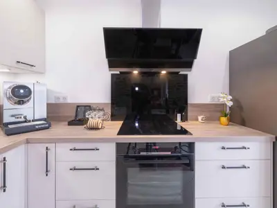 Cuisine ou kitchenette dans l'établissement Villa Prestige avec Spa et jeux