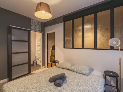 Un ou plusieurs lits dans un hébergement de l'établissement Appartement central calme à Reims - FR-1-870-8