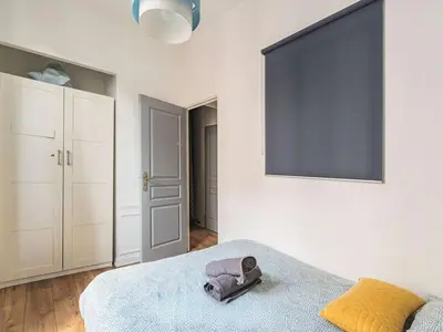 Un ou plusieurs lits dans un hébergement de l'établissement Appartement Lumière Hypercentre avec Wi-Fi à Reims - FR-1-870-14
