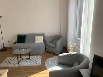 Coin salon dans l'établissement Location Conviviale à Reims avec Parking et Terrasse privée - FR-1-870-19