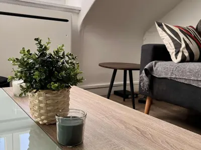 Coin salon dans l'établissement Charme Central : Grand Appart à Reims - FR-1-870-32