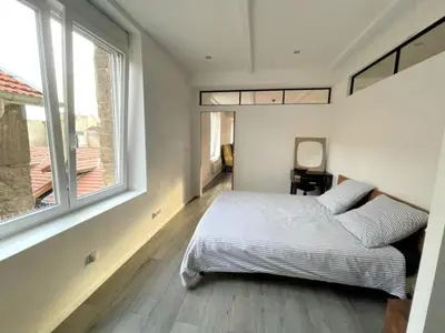 Un ou plusieurs lits dans un hébergement de l'établissement Grand Appartement 2 Chambres au Cœur de Reims - FR-1-870-34