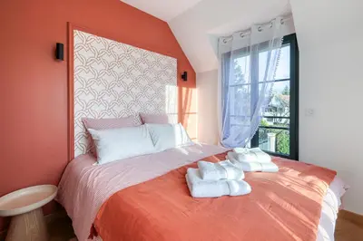 Un ou plusieurs lits dans un hébergement de l'établissement Le Jardin de Lili - Disney 30 min - Clim & Wifi