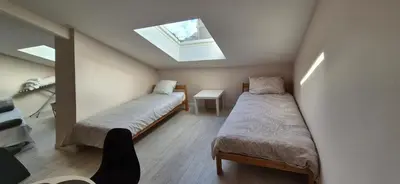 Un ou plusieurs lits dans un hébergement de l'établissement Appartement spacieux proche centre, 2ᵉ étage sans ascenseur, without lift