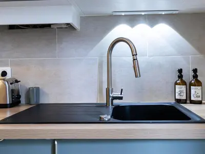 Cuisine ou kitchenette dans l'établissement Appartement de charme en hyper centre