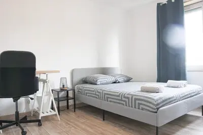 Un ou plusieurs lits dans un hébergement de l'établissement Smart Appart, spacious and functional