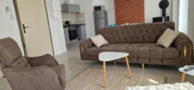 Coin salon dans l'établissement Deux appartements proche Disneyland