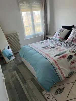 Un ou plusieurs lits dans un hébergement de l'établissement Appartement calme et cosy tout équipé